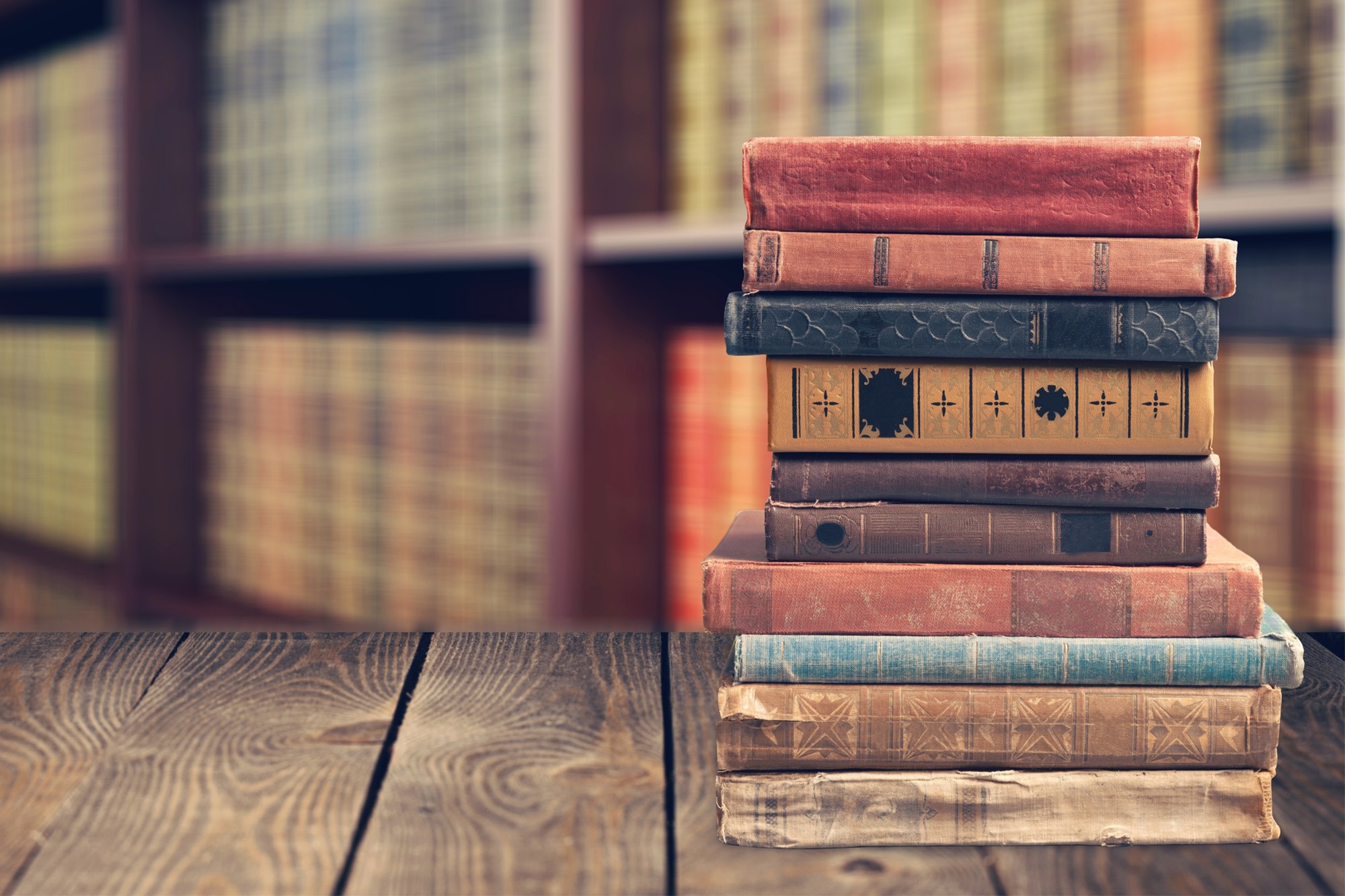 Stack of Books on Tablet.